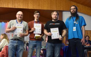 Siegerfoto des Wizard-Turniers mit Turnierleitung Lars Müller